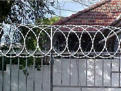 Razor wire flat concertina is installed on wire fence